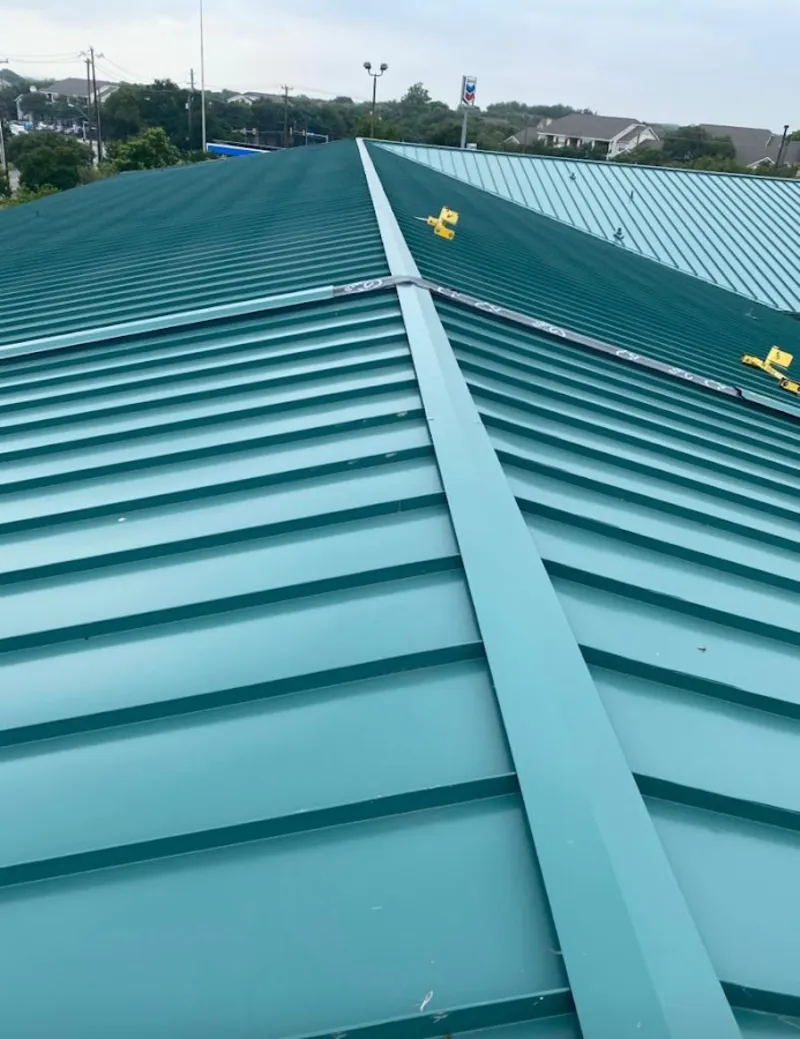 Green commercial metal roof ridge and valley for Metal Roof Repair in Canandaigua